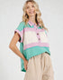 Woman wearing a colorful striped shirt with a white background