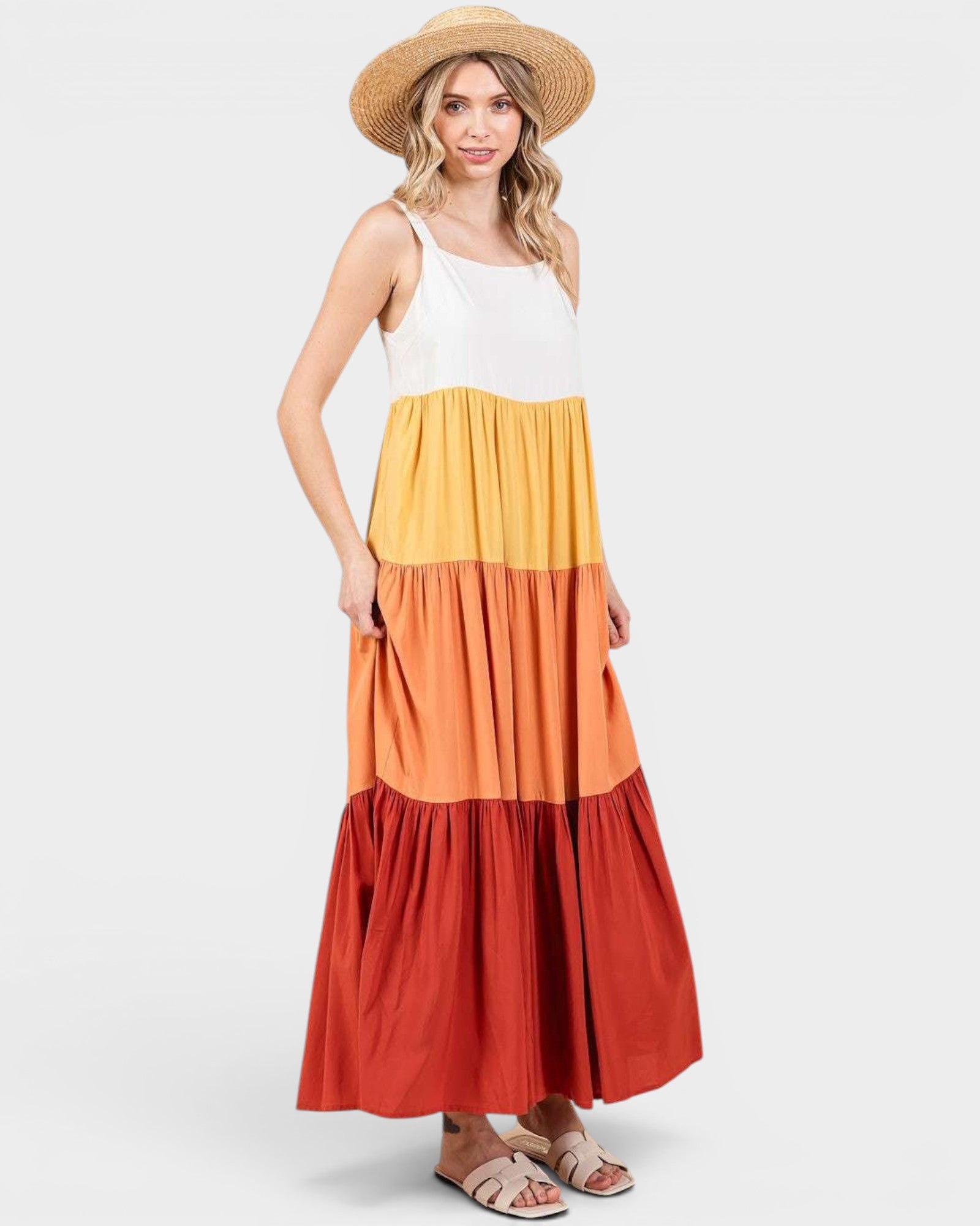 Woman wearing a multicolored dress with a white background