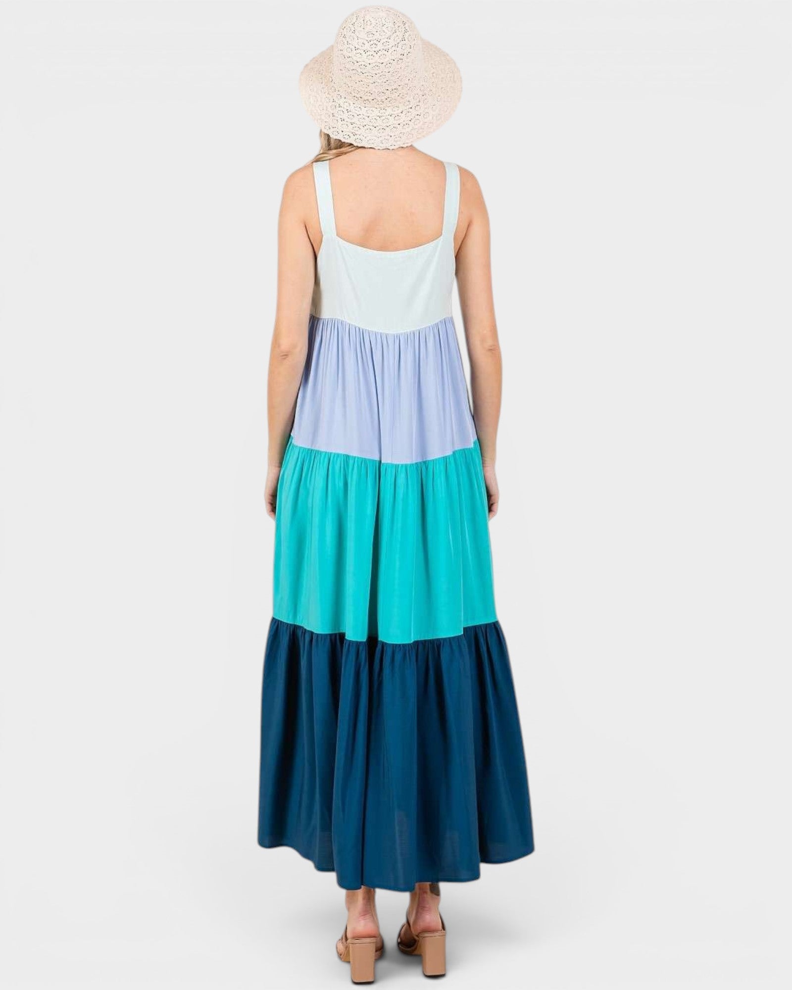 Woman wearing a multicolored dress with a white background