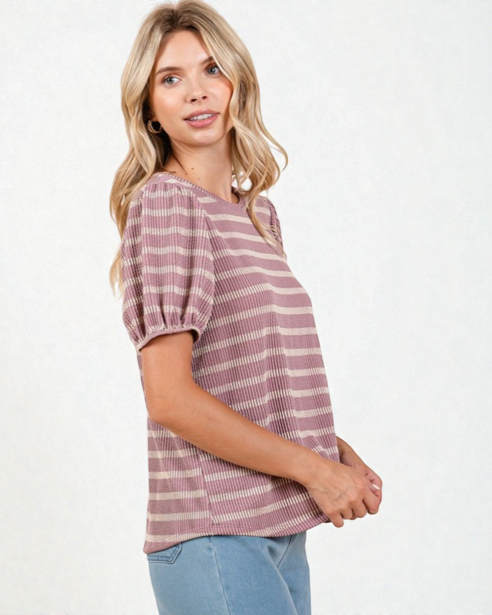 Woman wearing a striped shirt on a white background