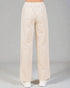 Beige pants worn by a person on a gray background