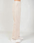 Beige pants worn by a person on a white background