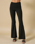 Black flared pants on a beige background