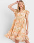 Woman wearing a floral dress on a plain background
