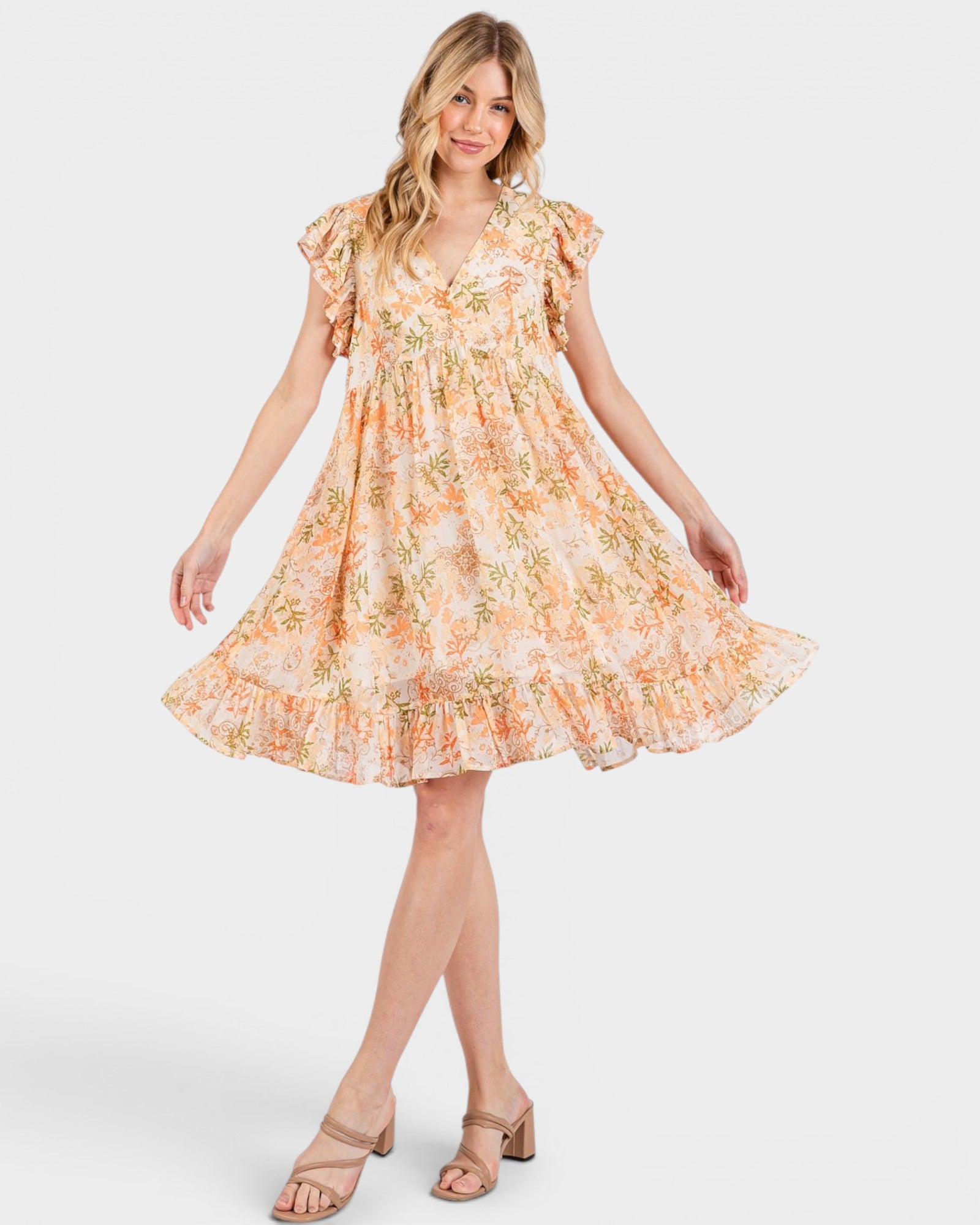 Woman wearing a floral dress on a white background