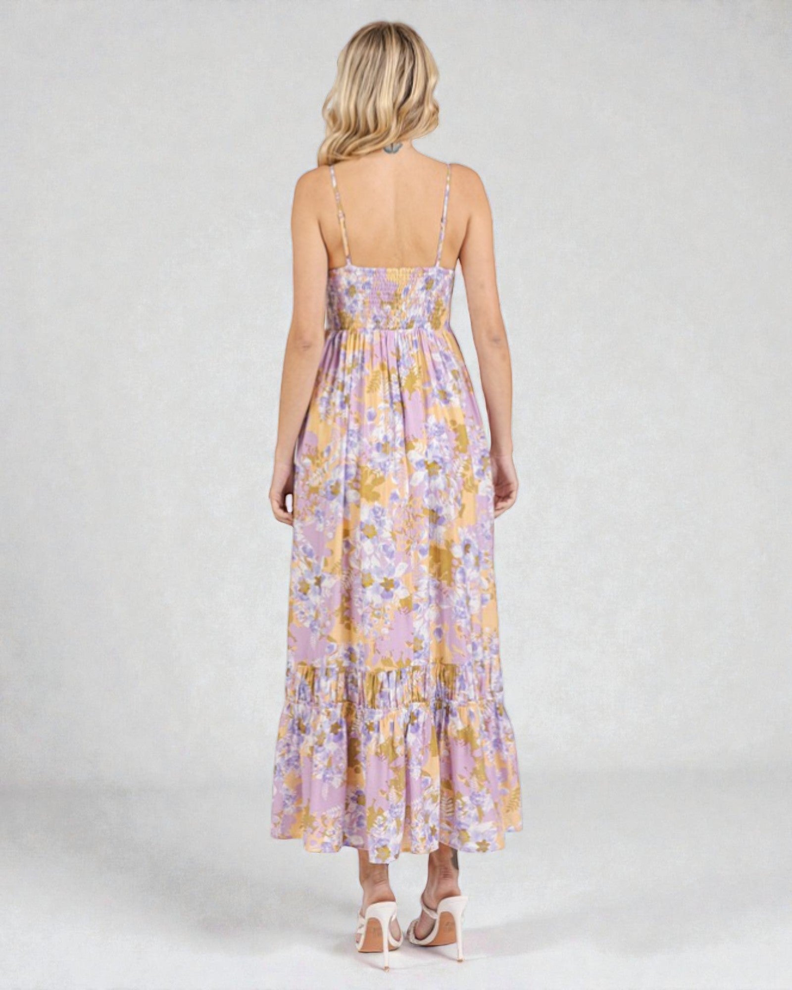 Woman wearing a floral dress on a white background