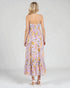Woman wearing a floral dress on a white background