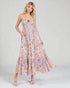 Woman wearing a floral dress on a plain background