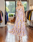Woman wearing a floral dress in a clothing store