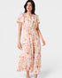 Woman wearing a floral dress on a white background