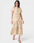 Woman wearing a floral dress on a white background