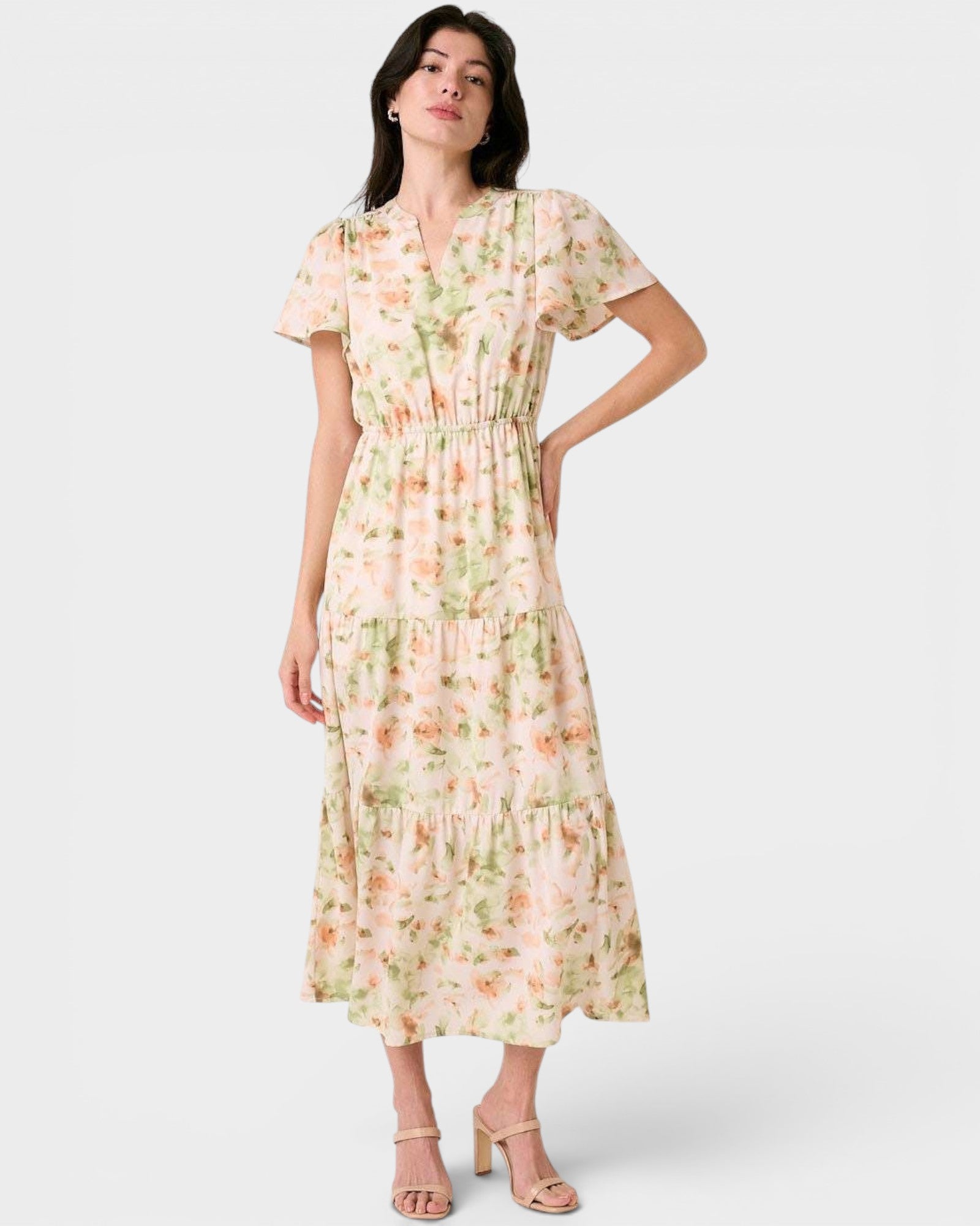 Woman wearing a floral dress on a white background