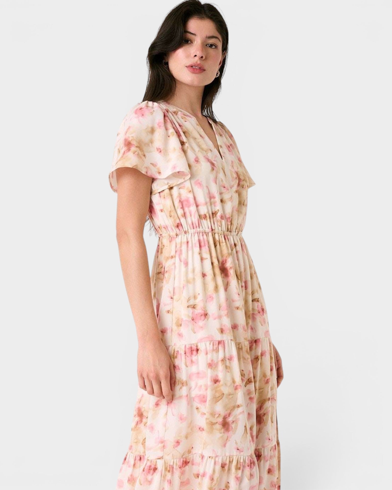 Woman wearing a floral dress on a white background