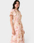 Woman wearing a floral dress on a white background