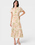 Woman wearing a floral dress on a white background