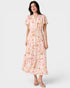 Woman wearing a floral dress on a white background