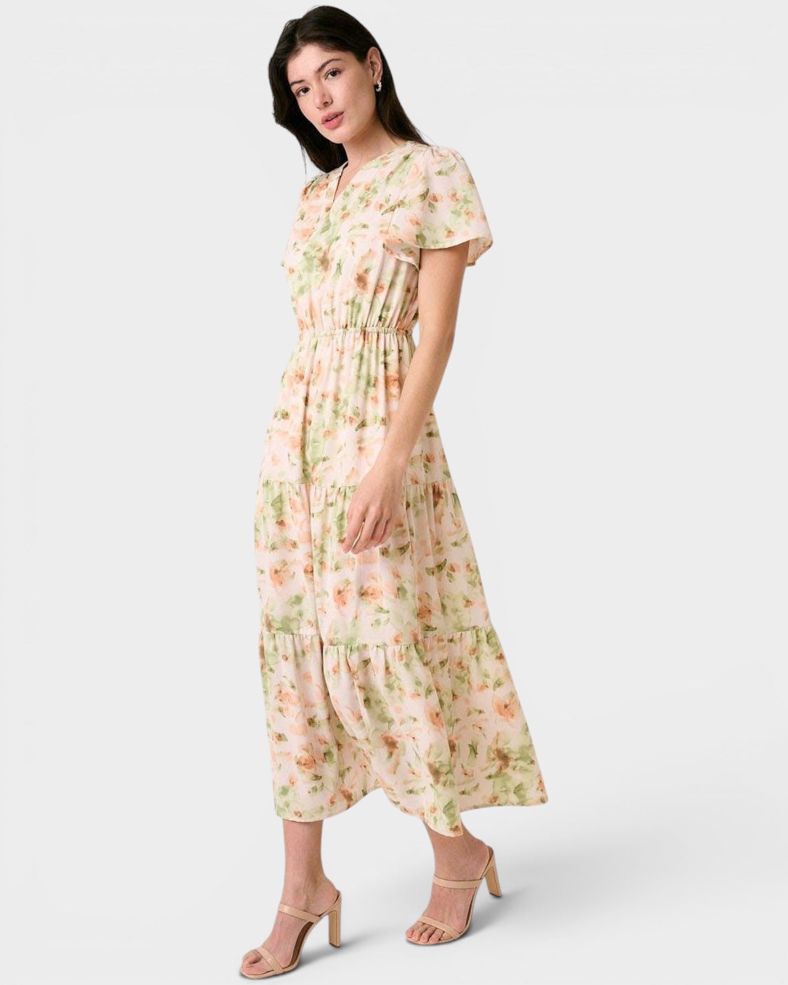 Woman wearing a floral dress on a white background