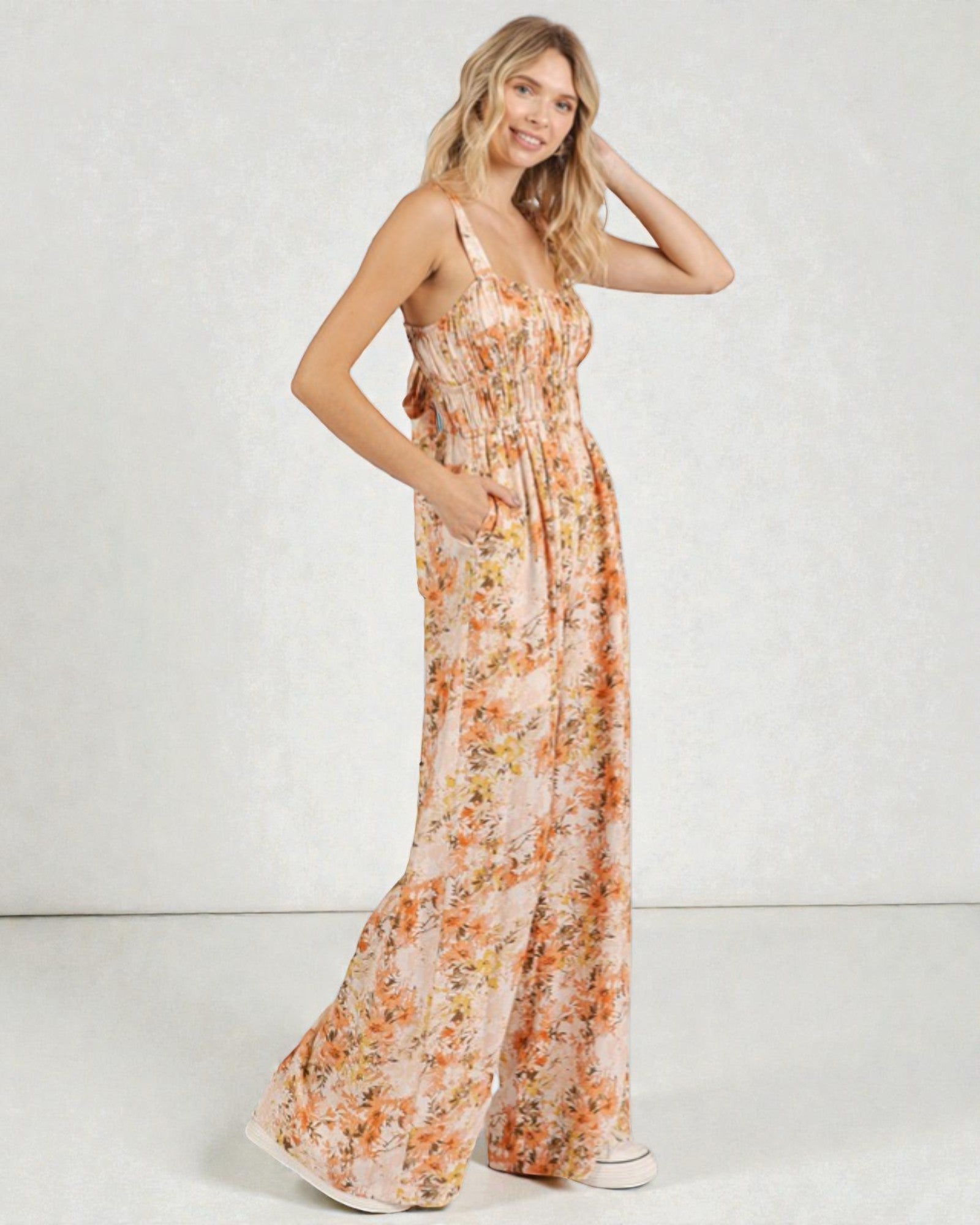 Woman wearing a floral dress on a white background