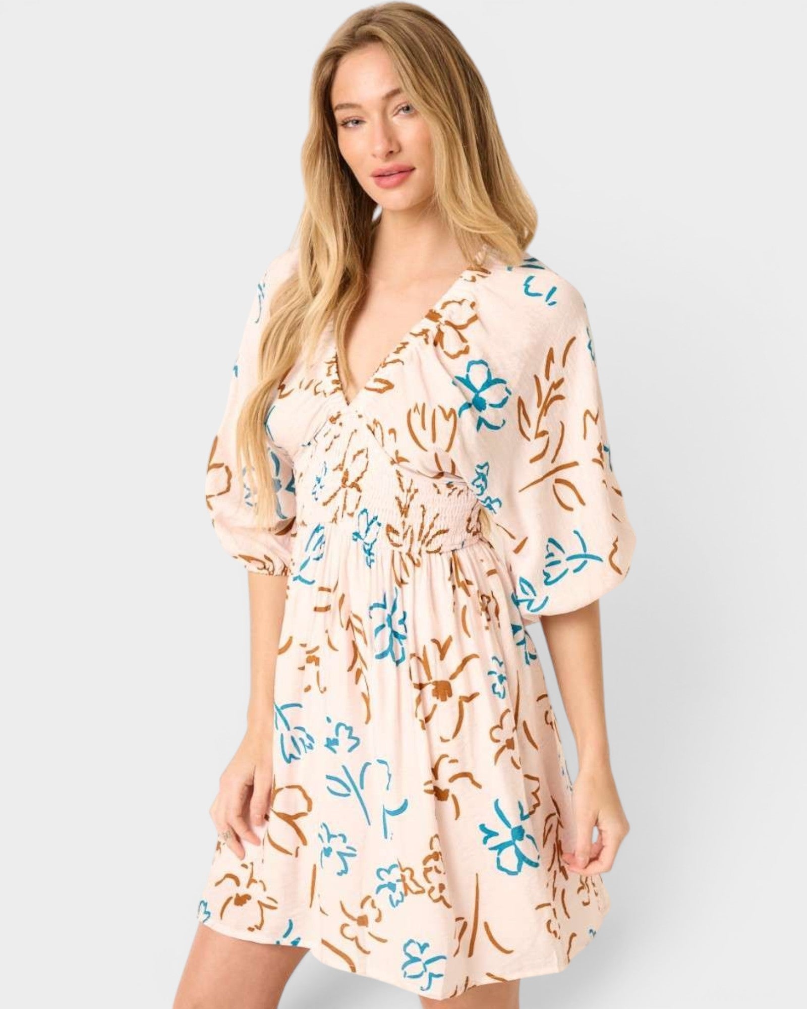 Woman wearing a floral dress on a white background
