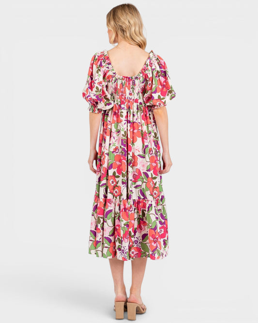 Woman wearing a floral dress on a white background