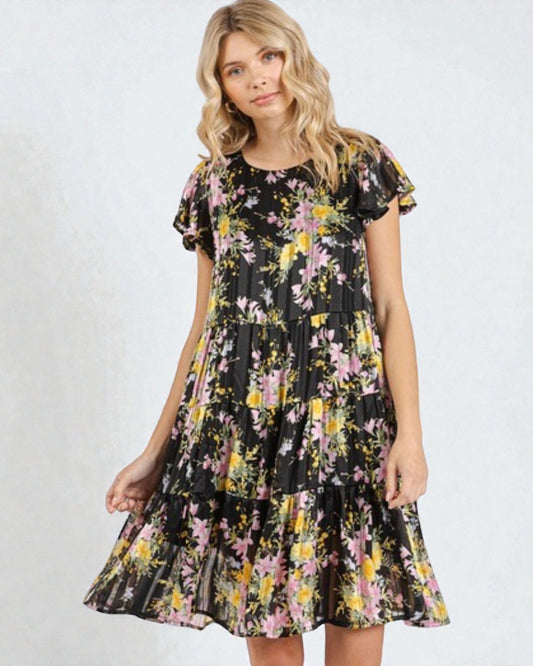 Woman wearing a floral dress on a white background