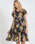 Woman wearing a floral dress on a white background