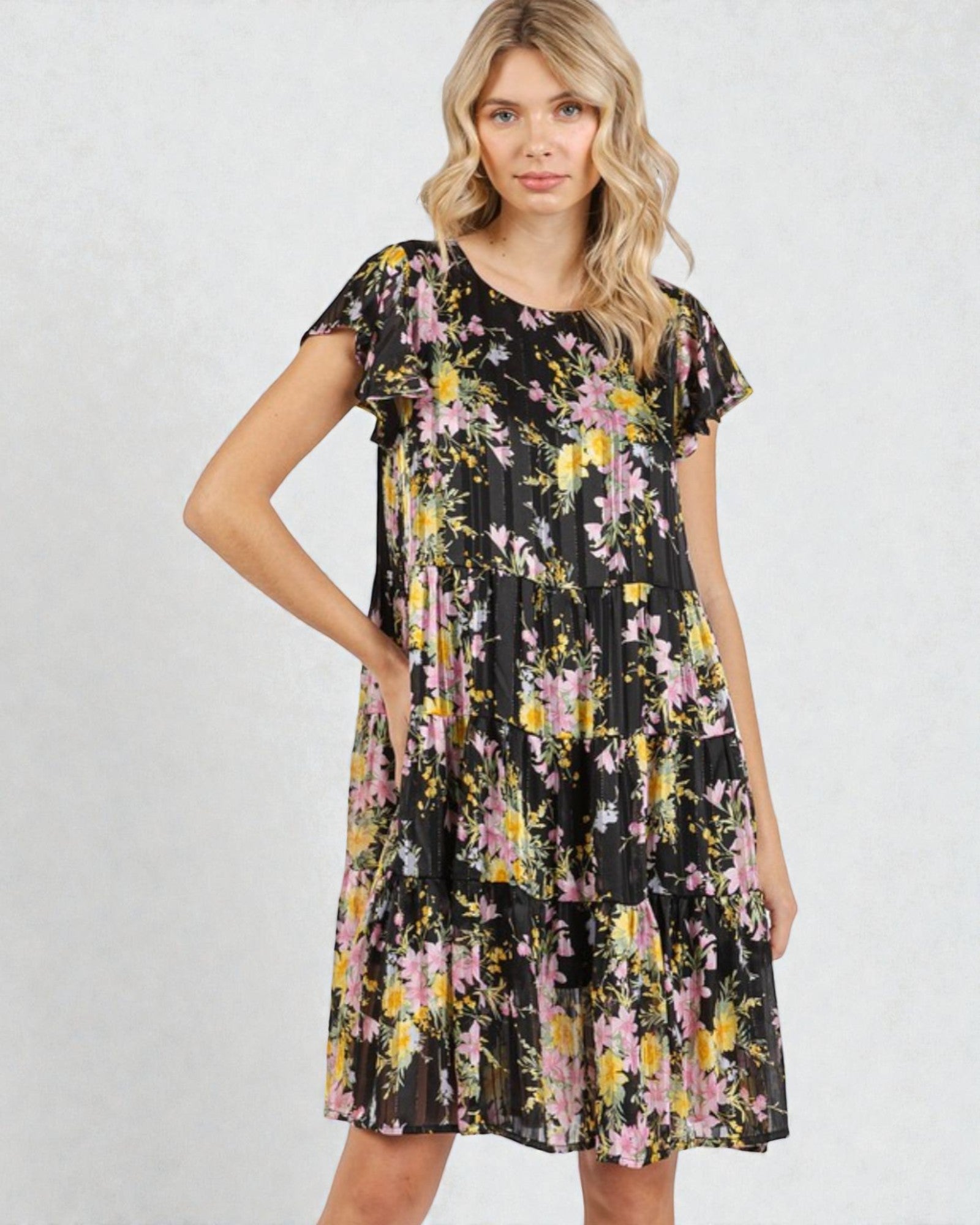 Woman wearing a floral dress on a white background