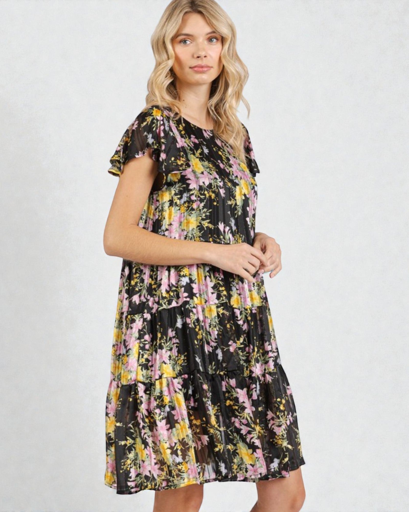 Woman wearing a floral dress on a white background