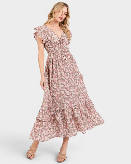 Woman wearing a floral dress on a white background