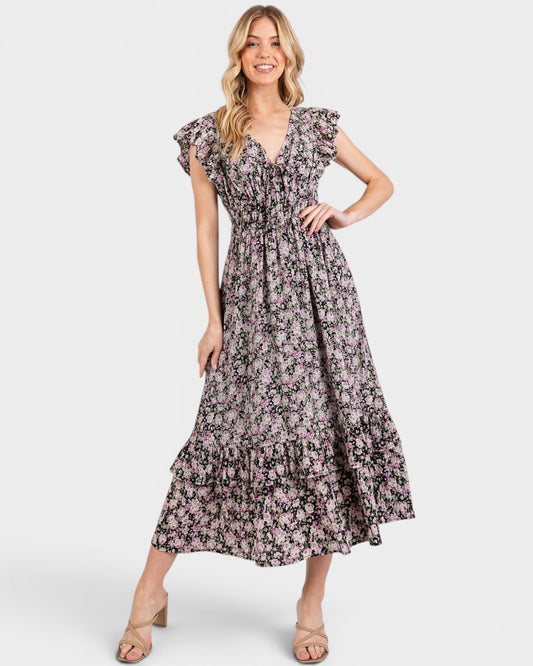 Woman wearing a floral dress on a white background
