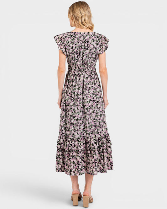 Woman wearing a floral dress on a white background