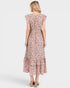 Woman wearing a floral dress on a white background