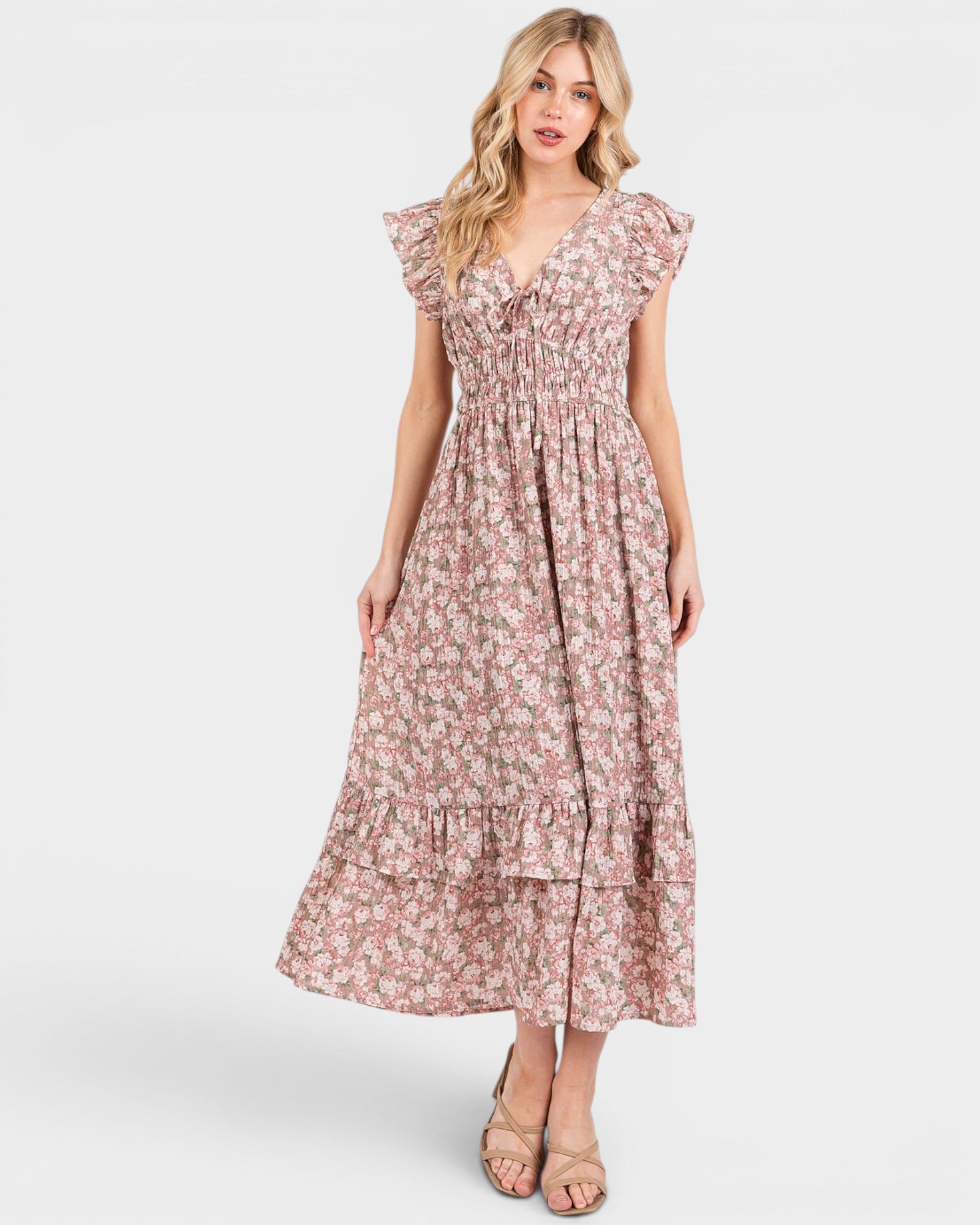 Woman wearing a floral dress on a white background