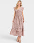 Woman wearing a floral dress on a white background
