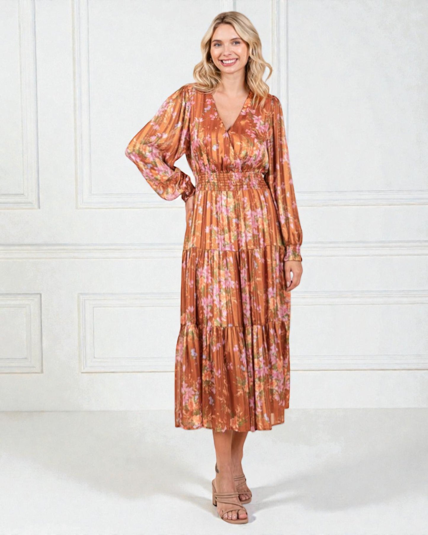 Woman wearing a floral dress with a white background