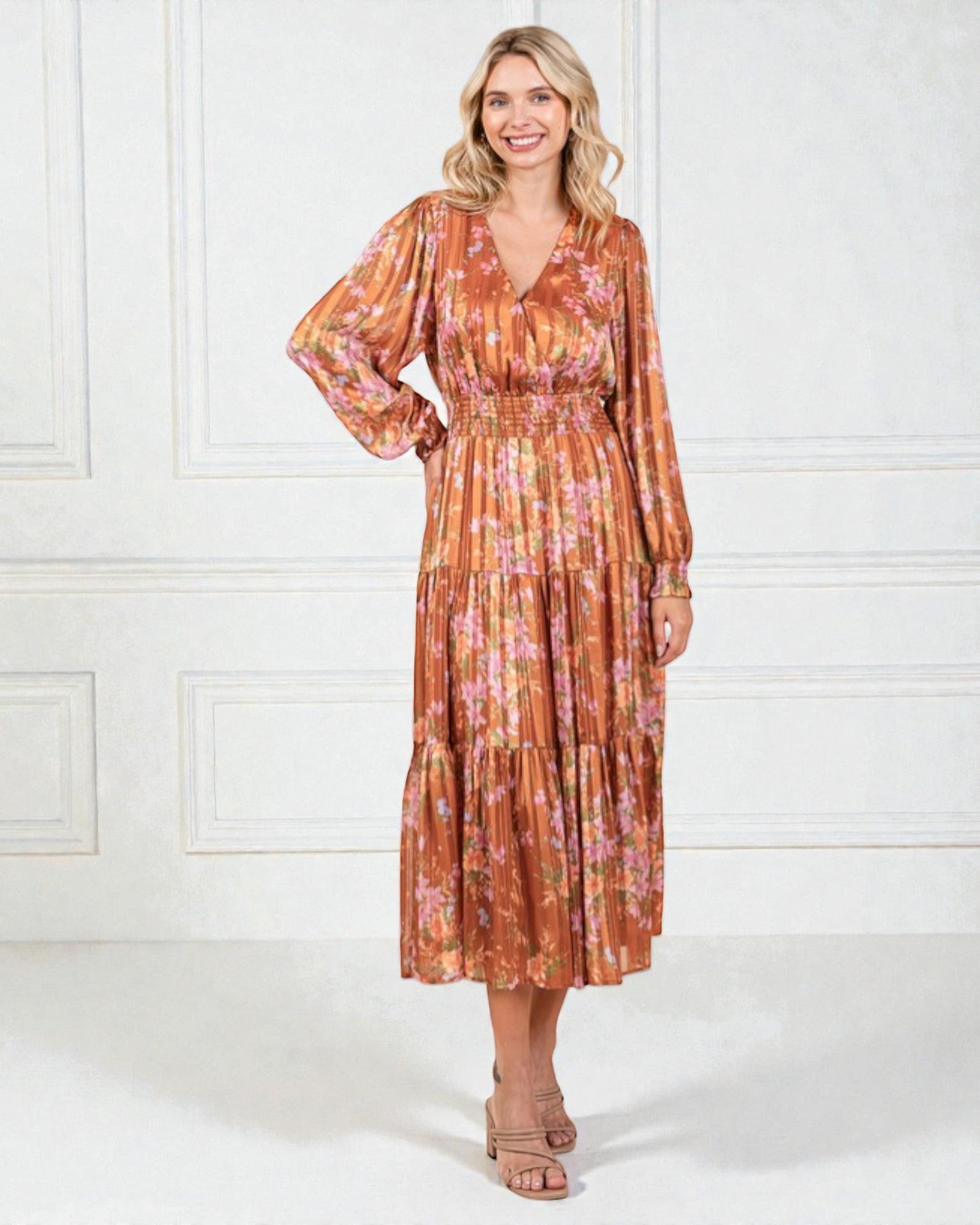 Woman wearing a floral dress with a white background