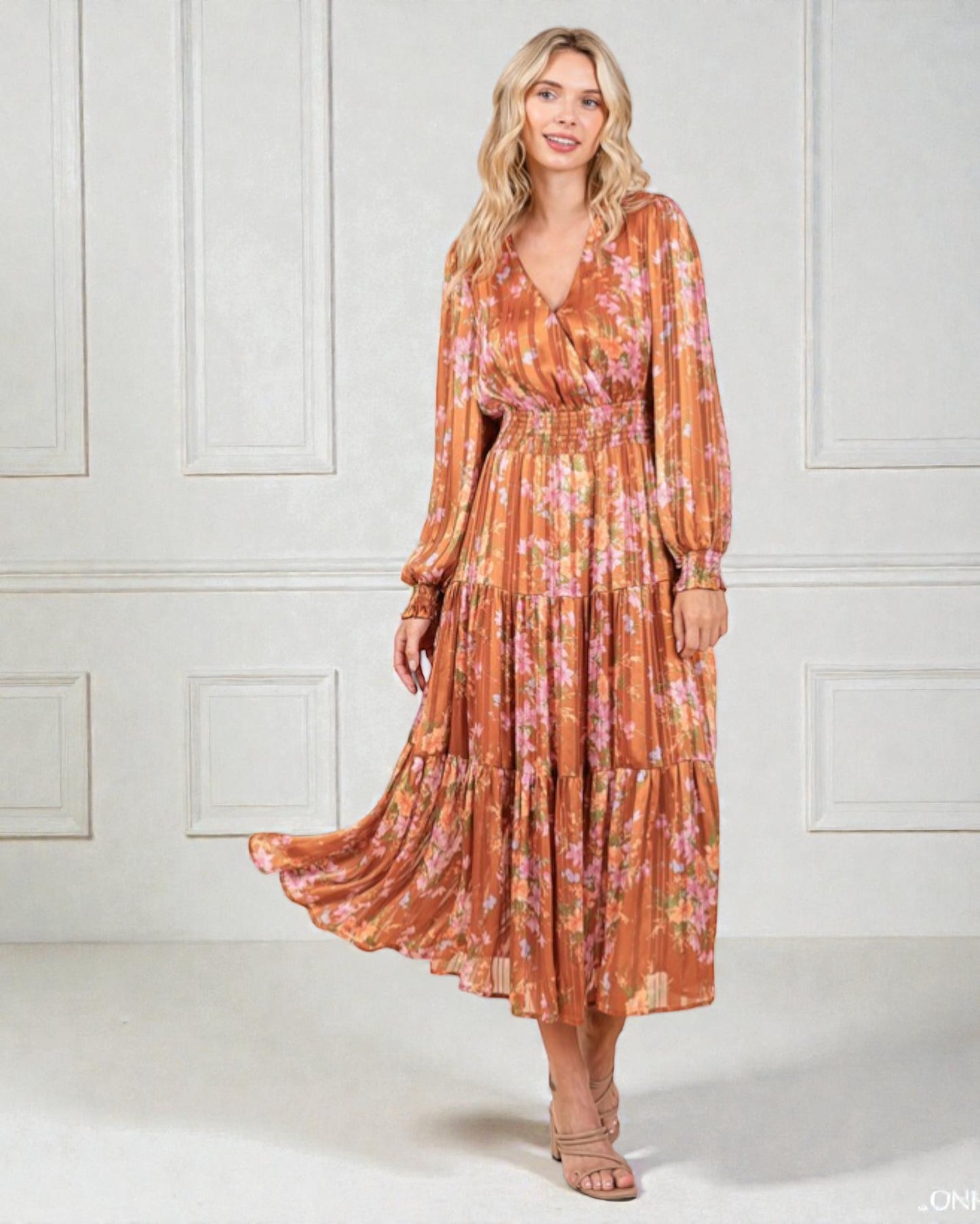 Woman wearing a floral dress with a white background