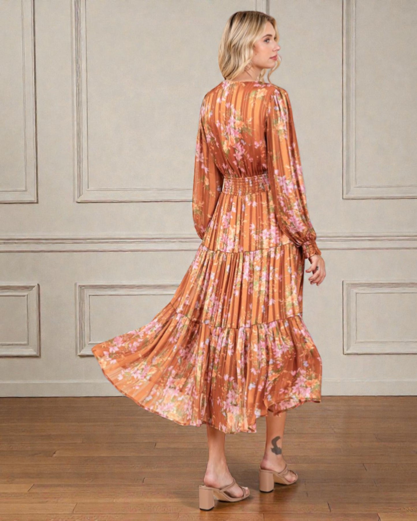 Woman wearing a floral dress with a neutral background