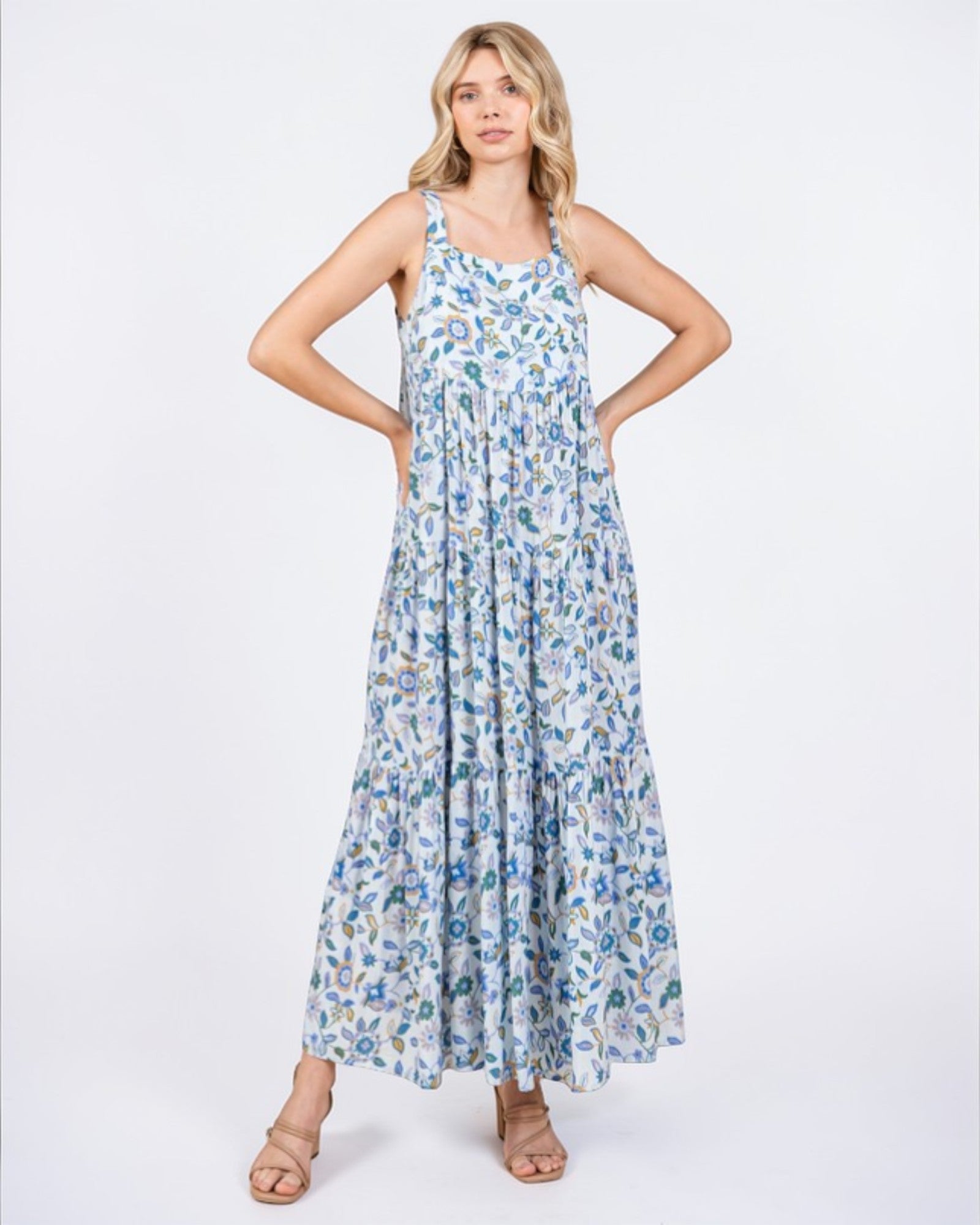 Woman wearing a floral dress on a white background