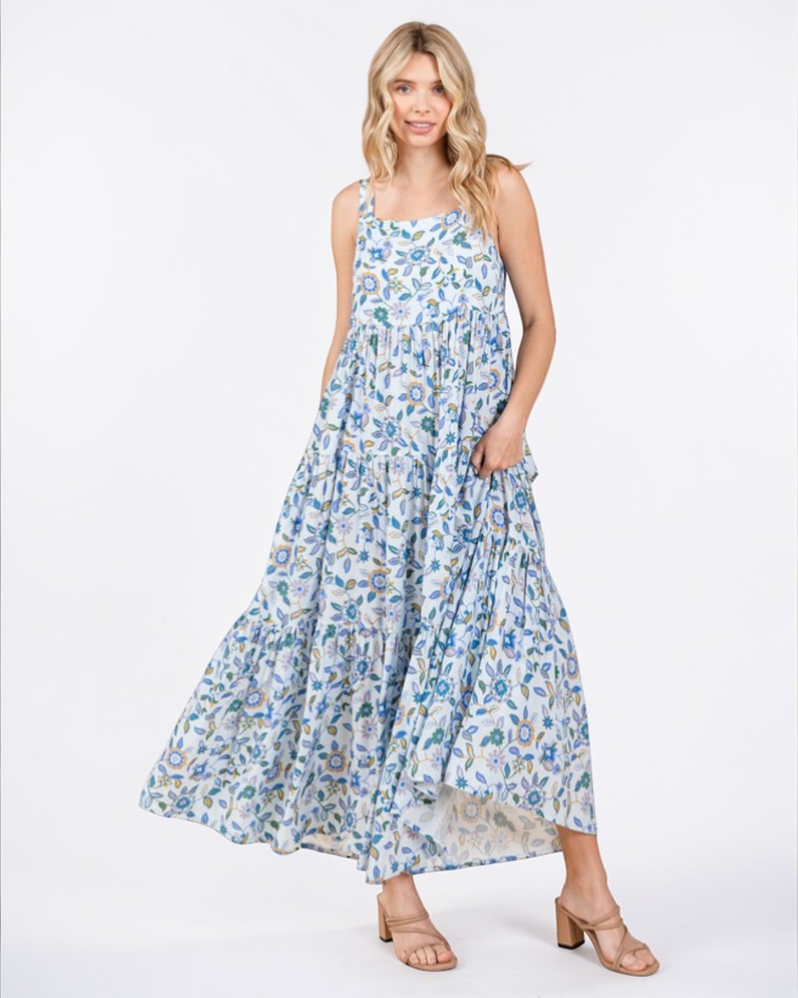Woman wearing a floral dress on a white background