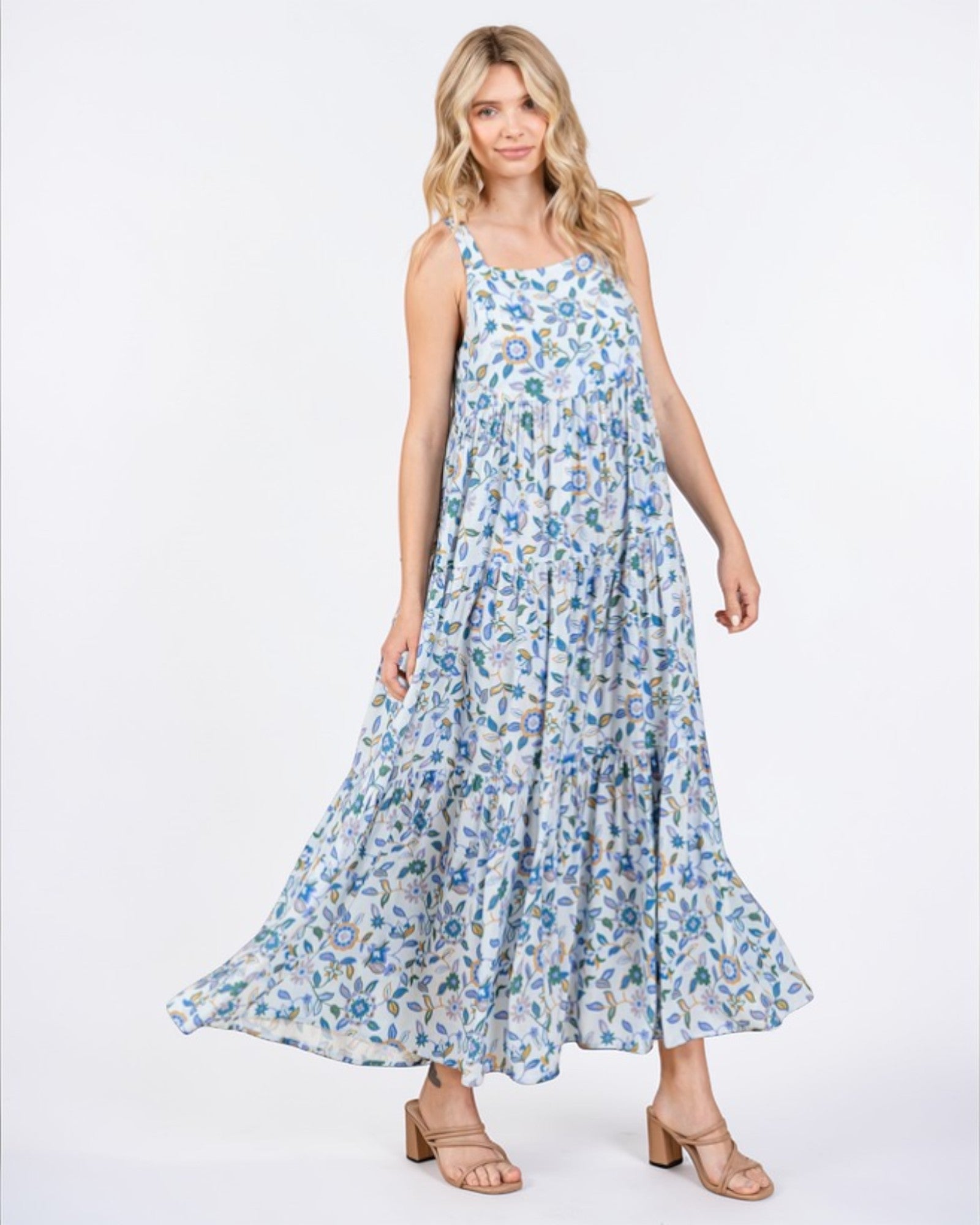 Woman wearing a floral dress on a white background