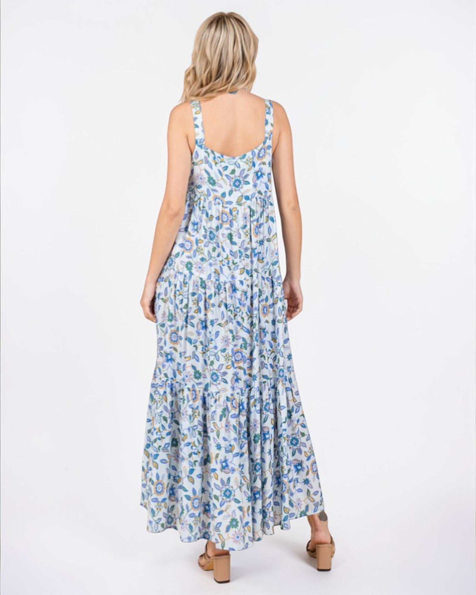 Woman wearing a floral dress on a white background