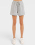 Gray shorts worn by a person on a white background