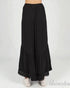 Black long skirt with ruffled hem on a white background