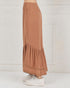 Brown tiered skirt worn by a person on a white background