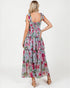 Woman wearing a floral dress with a white background
