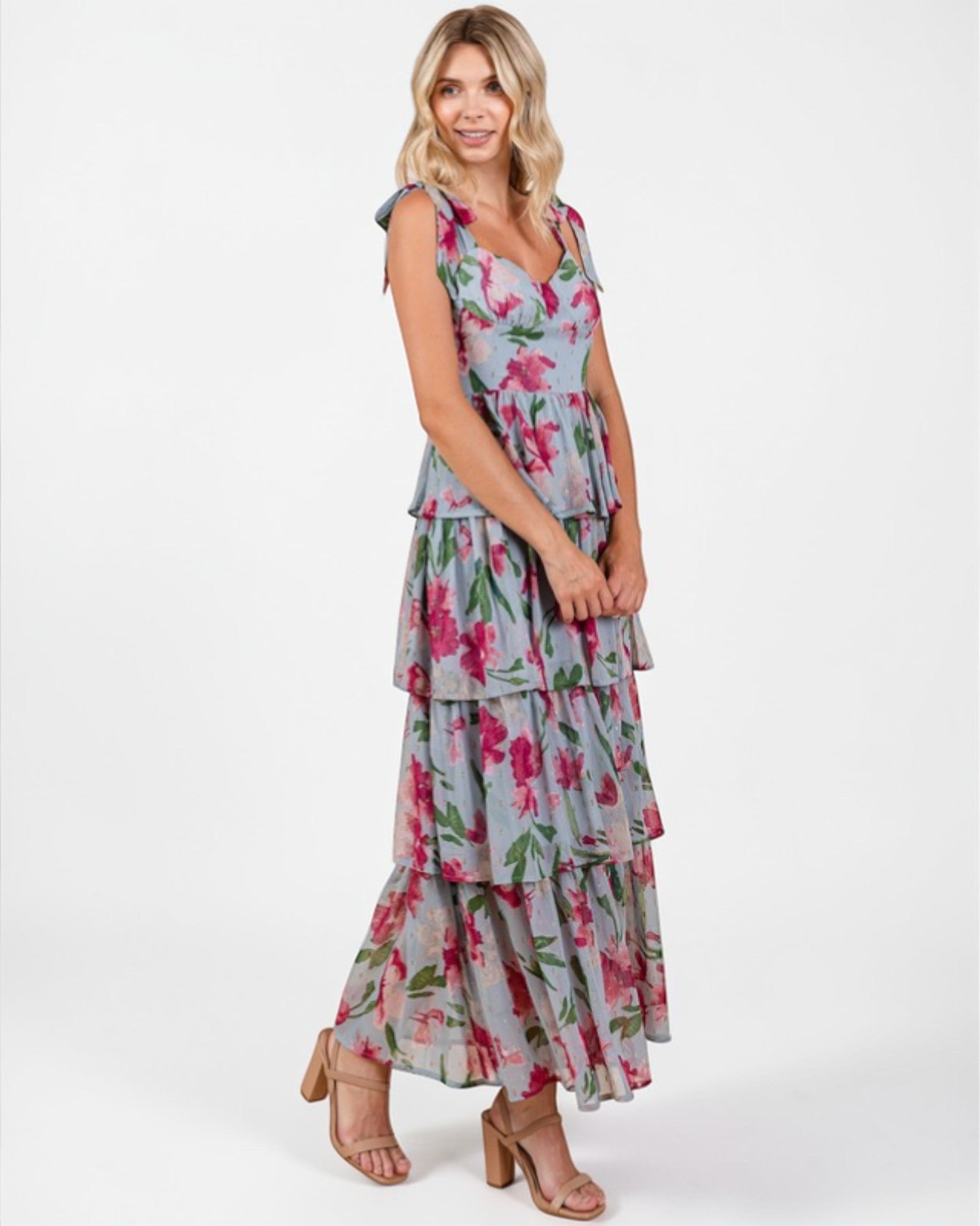 Woman wearing a floral dress on a white background