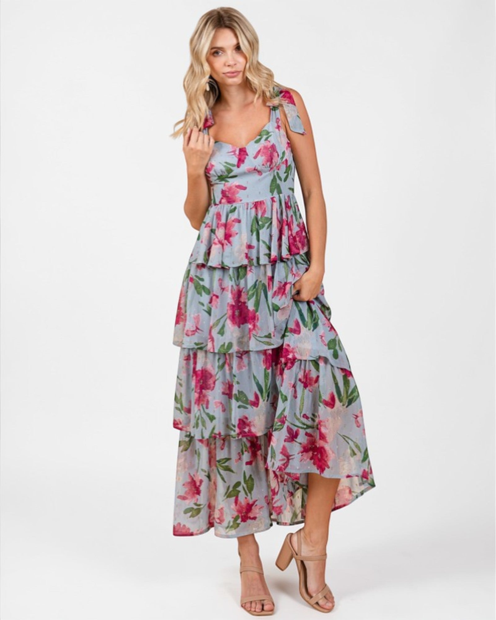 Woman wearing a floral dress on a white background