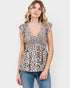 Woman wearing a leopard print top with ruffled sleeves on a white background