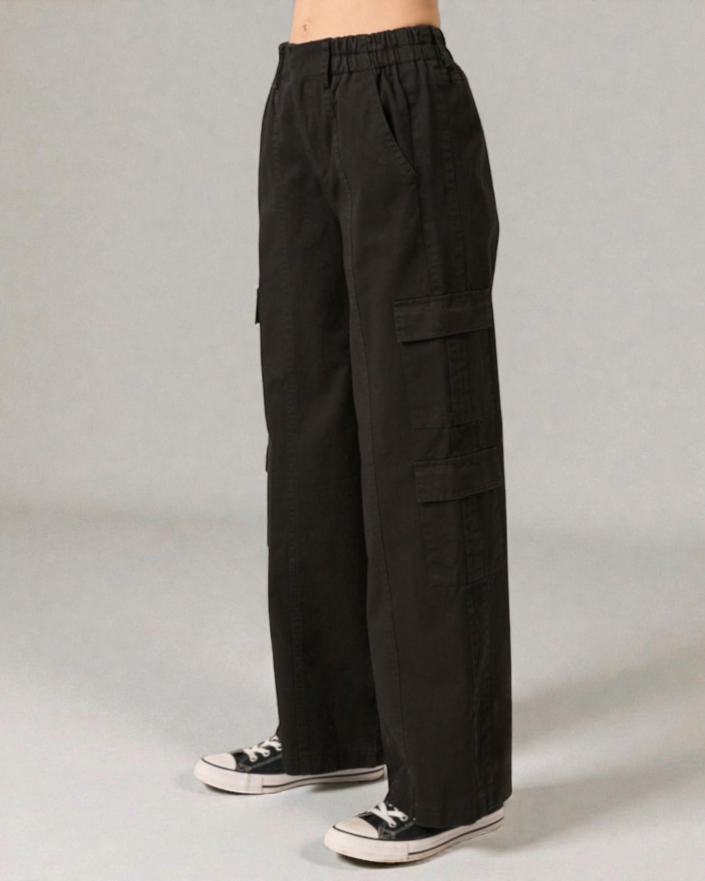 Black cargo pants on a gray background